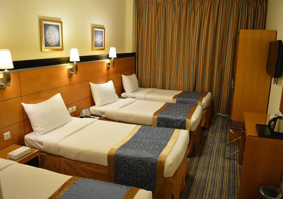 Room With 4 single Beds in Durrat Al Eiman Hotel