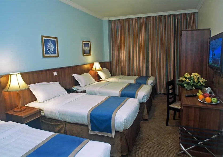 Room with 3 single beds