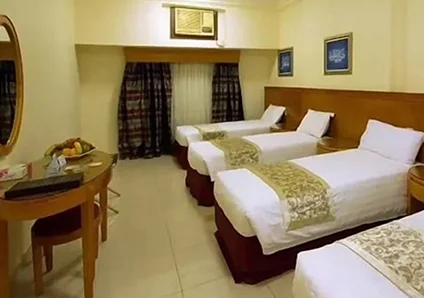 Room with 3 single beds