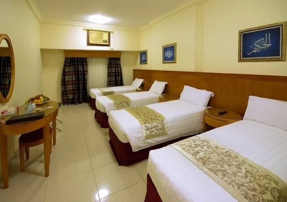 Room with 3 single beds