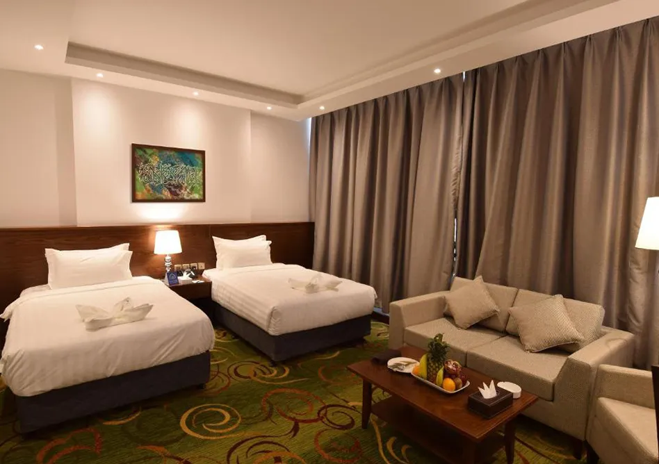 /media/umrah-images/2-single-beds-in-room%20%281%29.webp