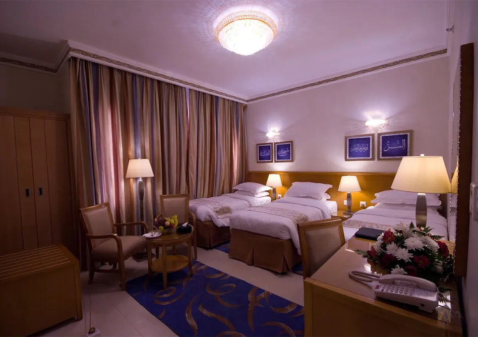 /media/umrah-images/3-single-beds%20%281%29.webp