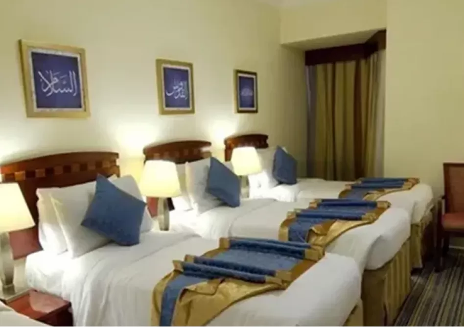 /media/umrah-images/4-single-beds-room%20%281%29.webp
