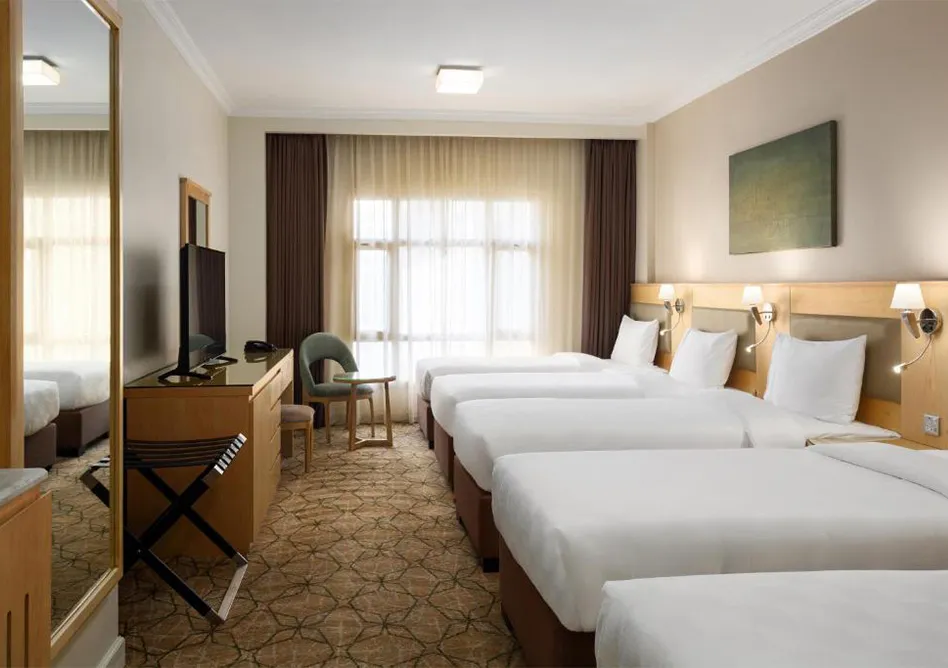 /media/umrah-images/5-single-beds.webp