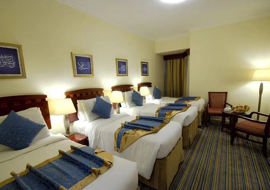 /media/umrah-images/four-single-beds-room%20%283%29.webp