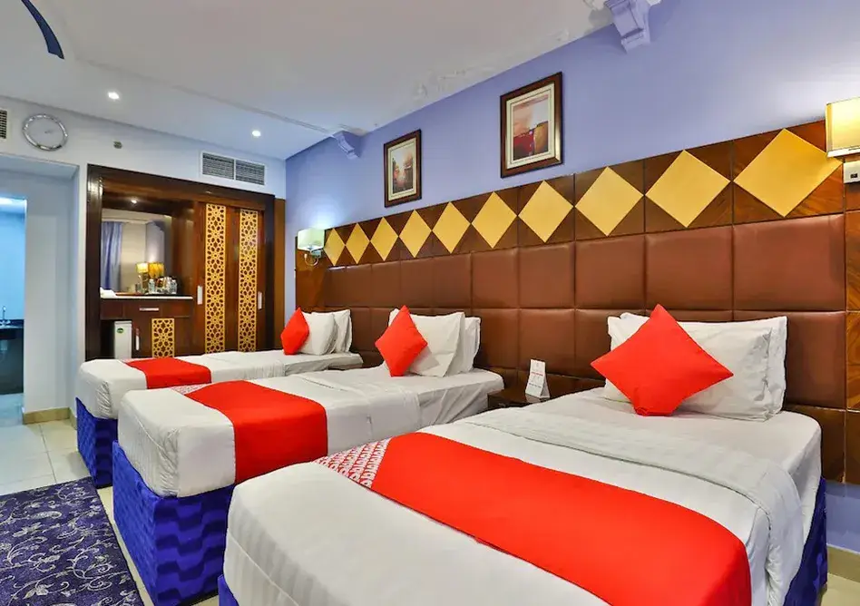 /media/umrah-images/room-with-3-single-beds-.webp