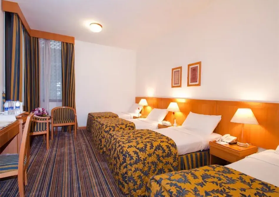 /media/umrah-images/room-with-4-single-beds%20%285%29.webp